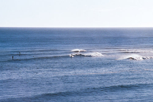 surfers catching a new years day swell in mtk ny